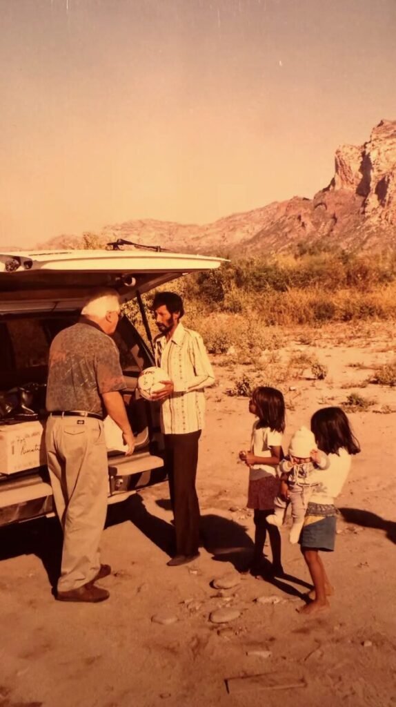 Historic photograph of Rotary Club San Carlos members making a community donation